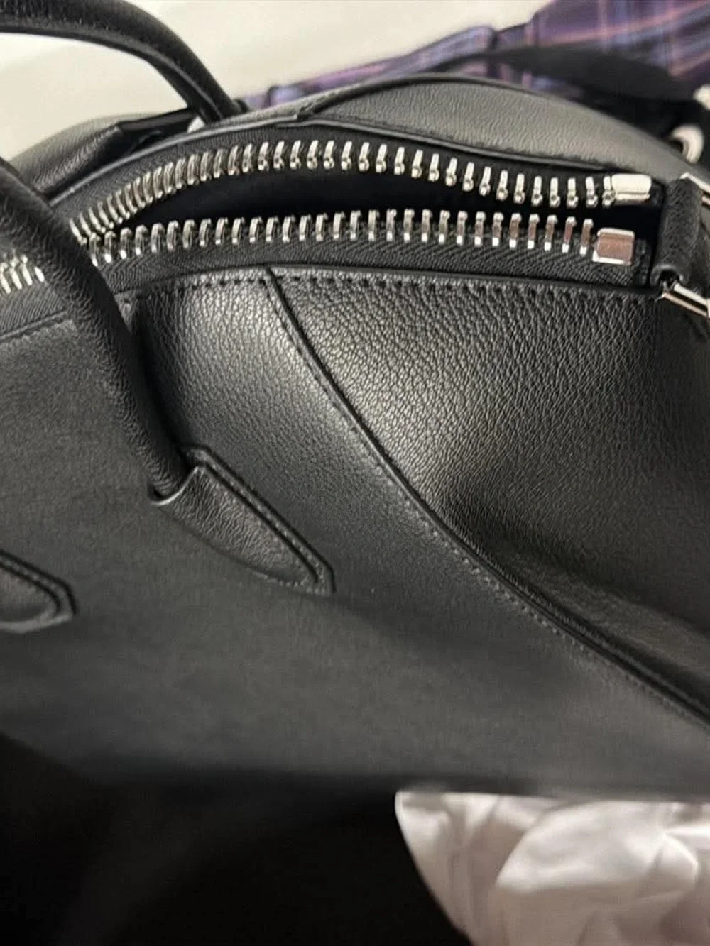 Black leather bag with strap